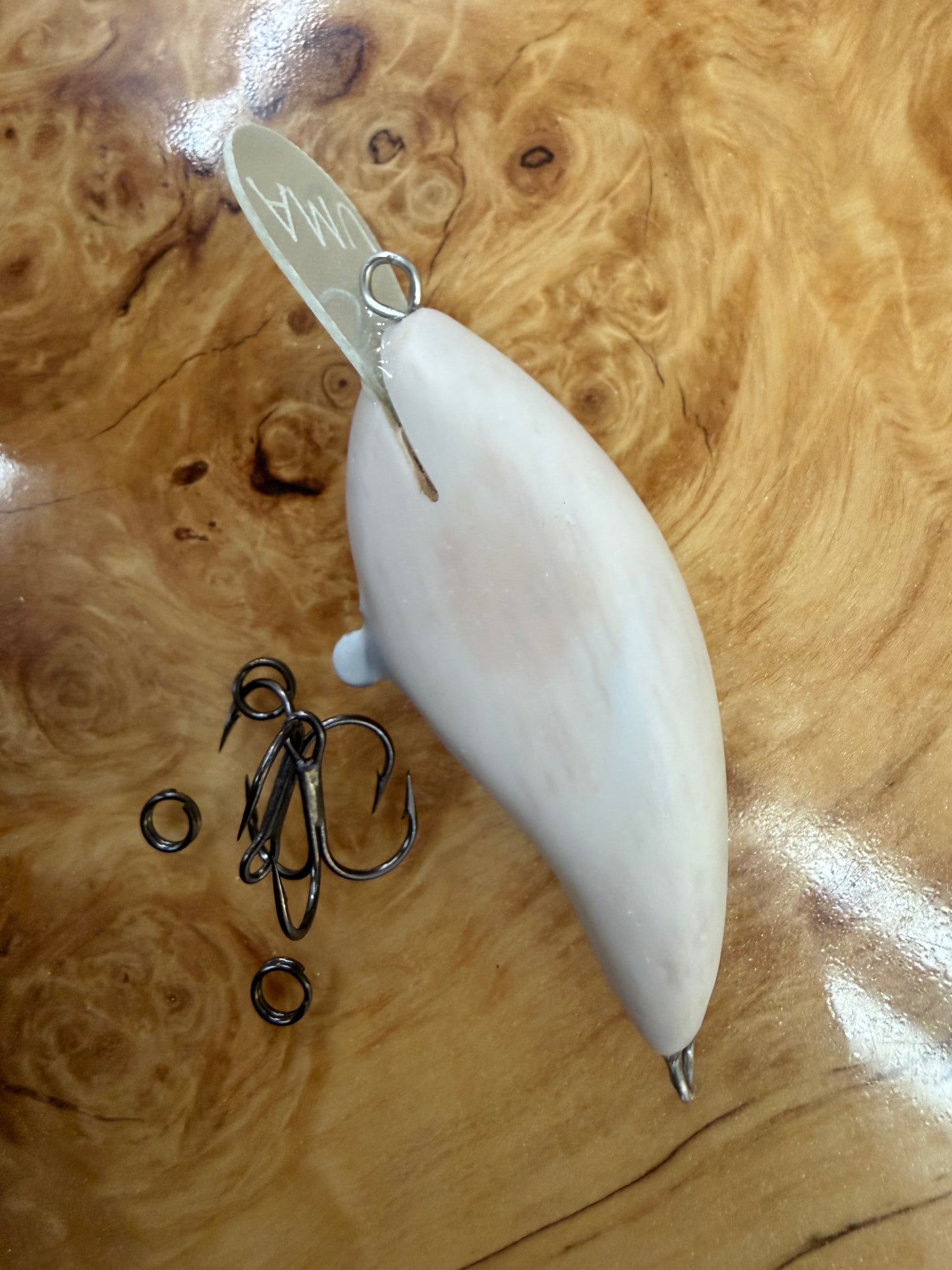 UMA Lure Co. Skinny Shad shallow:
Weight -3/8
Length- 2.25
Diving depth: 3-5ft
Tight but aggressive thump that trigger cold water fish into biting. Excels in fall through early spring.
Price includes custom paint.