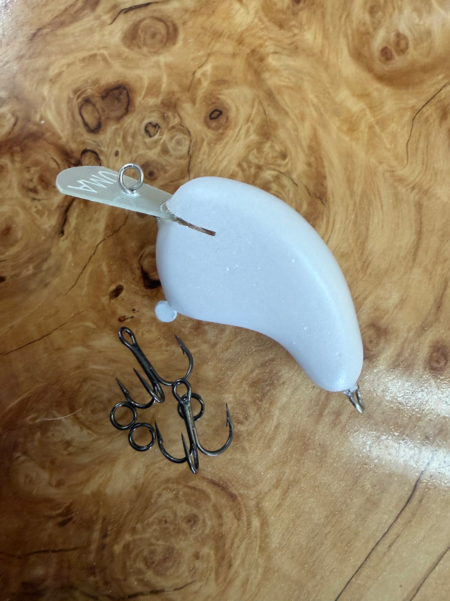 UMA Lure Co. - Balsa - Colt: 

Weight: 1/4oz
Length: 2 
Depth: 2-4

Featuring a small flatsided body and a wider rounded bill, this bait offers an erratic action yet tight wiggle. Price includes custom paint.